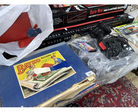 An Atari 2600 with assorted games, together with a vintage Bayko set.  