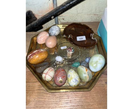 An Eastern brass tray / charger together with selection of various egg ornaments to include marble, onyx, bended jasper, etc 
