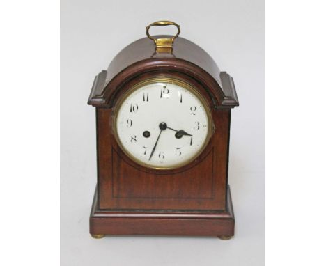 A French mahogany cased mantle clock, circa 1900, height 28cm.Marks and scratches in places, repair done on the right side co