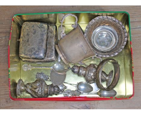 A tin of assorted hallmarked silver comprising two cigarette cases, a bangle, a twin handle cup, an embossed bowl, salt and p