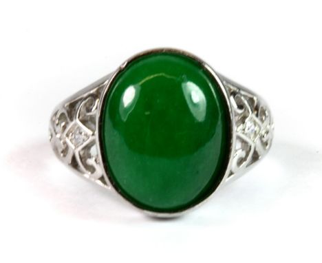 A 925 silver ring set with a cabochon cut jade and cubic zirconias (Q).