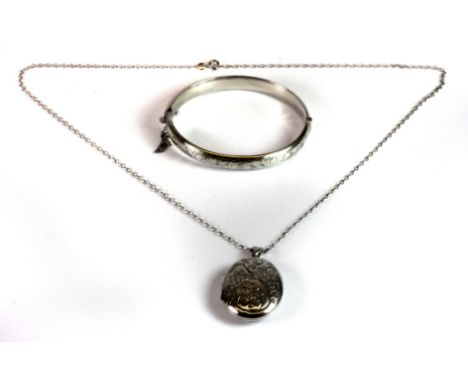 A 925 silver locket and chain with a hallmarked silver bangle.