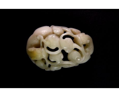 A 19th century Chinese carved mutton fat jade box cover decorated with two young dragons among Ruyi shaped vines, Width. 6cm,