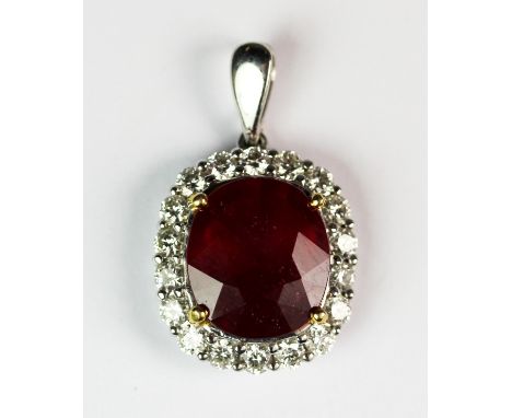 A lovely 18ct white gold (stamped 750) pendant set with a large ruby (approx. 8ct) surrounded by 0.90ct brilliant cut diamond