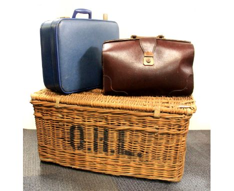A vintage wicker linen basket, canvas trunk, briefcase and over night case.