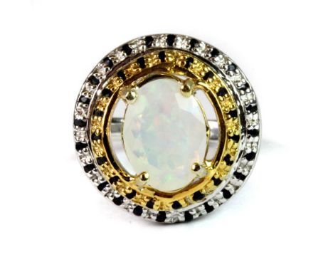 A 925 silver gilt ring set with an oval cut opal and sapphires (N).