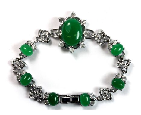 A lovely white metal bracelet set with jade and cubic zirconias.