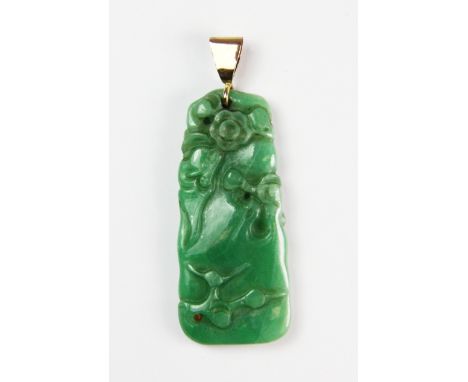 A superb 19th century Chinese carved apple green jadeite jade pendant of rocks and flowers, L. 4.5cm, with yellow metal (test
