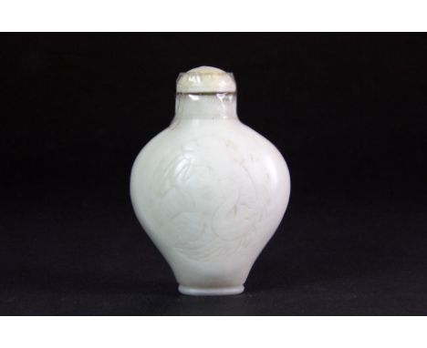 A Chinese carved mutton fat jade snuff bottle engraved with a duck and peaches, H. 5.5cm, Prov. The late Bob Marion collectio