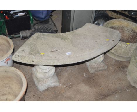 A concrete bench raised on plinths in the form of squirrels