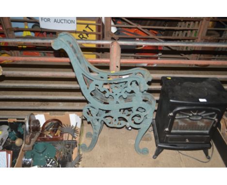 A pair of garden bench ends with lion mask decoration