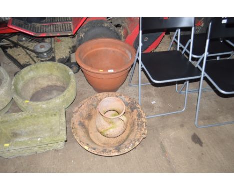 A large terracotta planter; together with a terracotta plant holder AF and a terracotta vase