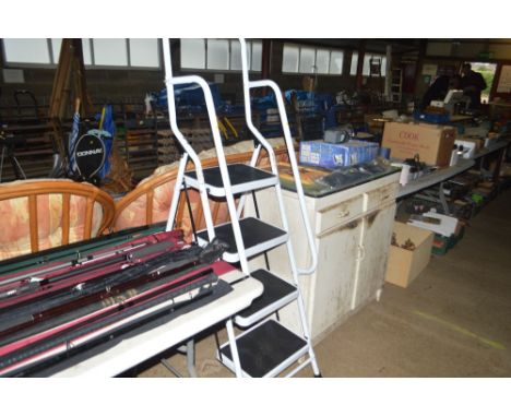 A folding ladder with guide rail