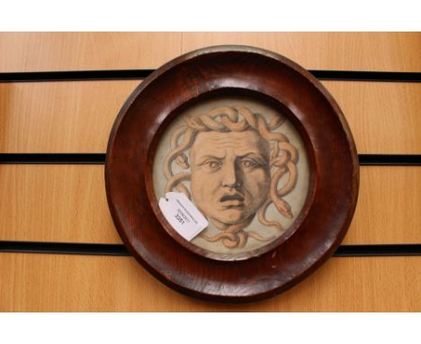 Circular drawing, pencil and watercolour on laid/chain-lined paper, depicting the head of Medusa. Antique circular wooden fra