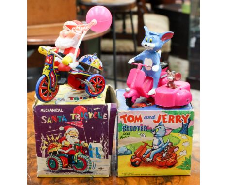 Two boxed toys, including Tom & Jerry Scooter, Marx Toys and mechanical Santa Tricycle