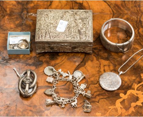 A selection of silver and white metal jewellery comprising of a silver bangle, silver lockets x2, RAF Medal, white metal broo