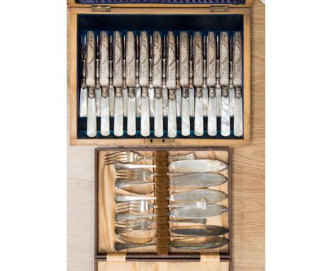 A boxed set of a fruit service, with mother of pearl handles (for 12) and a boxed set of fish eaters (2)