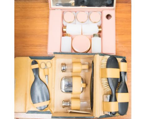 A gentlemen's toiletries case with a flap lid from the 1930s, contains mirrors, brushes, toiletries, bottles, toothbrush, etc