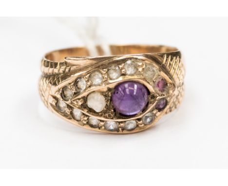 An amethyst and white stone serpent style ring, with a central canochon amethyst and white, pink and purple stone surround, s