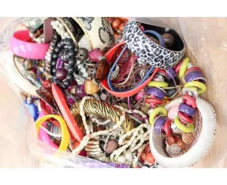 A selection of costume jewellery including faux pearl and ribbon necklaces, plastic, resin, metal and bead necklaces, bangles