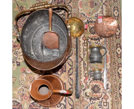 A collection of assorted copperware, comprising coal bucket, shovel, toasting fork, skimmer ladle, pewter mugs, measuring jug