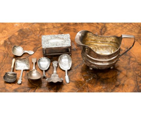 Seven silver caddy spoons, mostly Victorian and indistinct hallmarks; together with silver jug London 1808, and matchbox hold