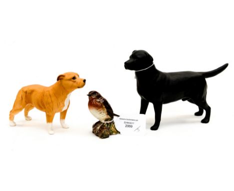 A Royal Doulton matte Staffordsire Bull Terrier, light tan, a Beswick 'Wendover' matte black labrador and a Beswick robin