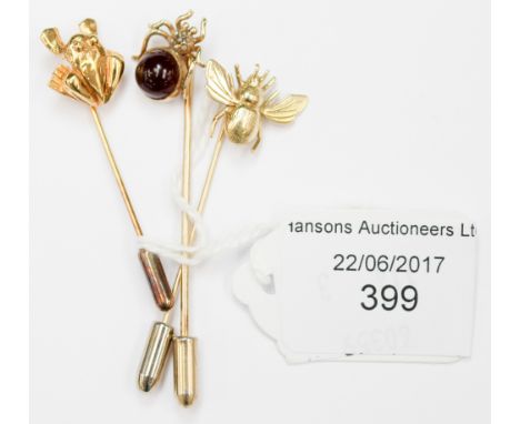 Three novelty stick pins comprising one 14ct stamped spider set with carnelion and seed pearl, and one 9ct gold frog pin, and