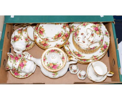 A Royal Albert 'Country Roses' part dinner and comprehensive tea service, including two tier cake stands, large teapot, napki