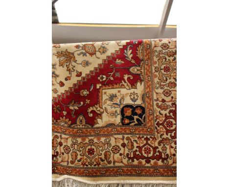 A Heriz beige ground woollen carpet, 2.30m x 1.60m