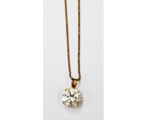 An 18ct claw set CZ (approx 1ct) solitaire pendant on a 9ct gold chain approx 18''. 