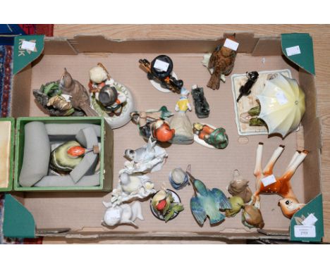 Group of ceramic figures including Goebel group Norman Rockwell Rock 217, a Goebel Robin 1963, a Geobel figure of a child No.