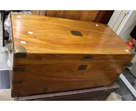 A teak and brass bound travelling trunk