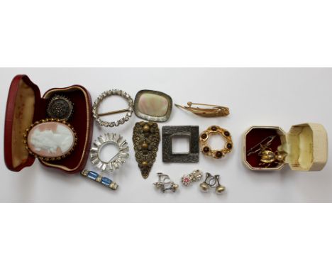 A collection of eleven brooches and scarf clips with various designs, to include a white metal Victorian style brooch, a silv