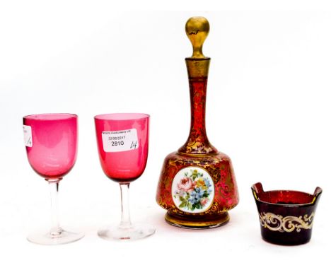 A Bohemian Cranberry glass decanter, having two overlaid hand painted plaques, depicting a young girl and flowers, with a red