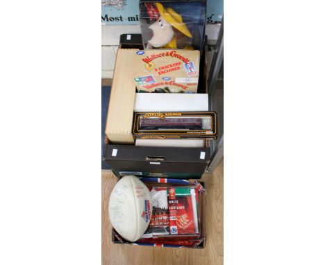 Three boxes of assorted toys and sporting items to include: Lledo boxed vehicles, Mainline Railways boxed locomotives, a sign