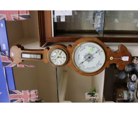 A Victorian Banjo Barometer, Railway interest G.W.R, with central clock and crest below 