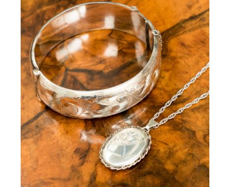 Silver bangle and locket on chain