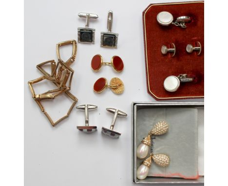 A pair of Christian Dior faux pearl earrings, along with a pair of yellow metal Gucci cufflinks mother of pearl check board w