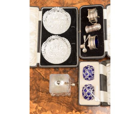 A cased silver condiment set retailed by Grant and Son, Carlisle; together with cut glass jam jar with silver lid and associa