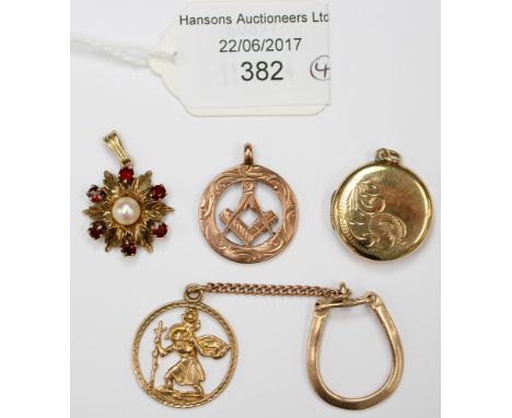 A selection of 9ct gold pendants comprising of one 9ct gold front and back locket, one 9ct masonic medallion, one 9ct gold St