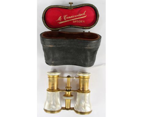 A pair of Parisienne opera glass, mother of pearl casing circa 1928, in original blue leather case and box 