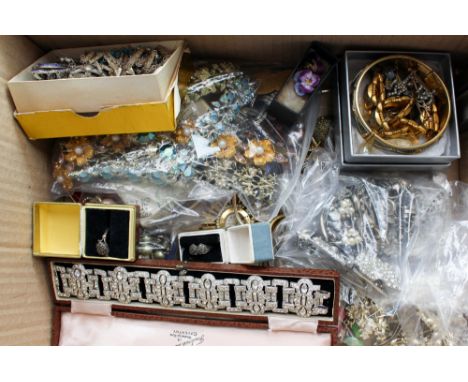 A quantity of assorted costume jewellery to include a 1930's paste bracelet set in white metal (boxed), a white and yellow me