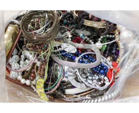 A selection of costume jewellery including plastic, faux pearl, wood, glass and metal, resin, bead necklaces, rings, bangles,