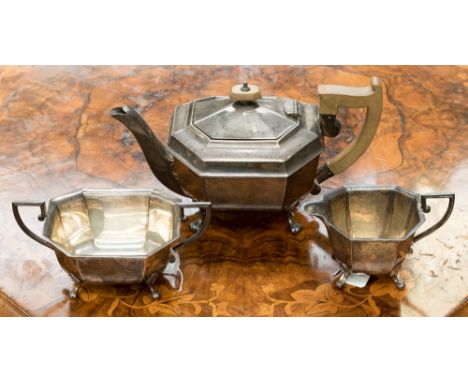 A three piece silver teaset, the teapot having fruitwood handle and finial, Sheffield 1934, Emile Viner, total weight approx 