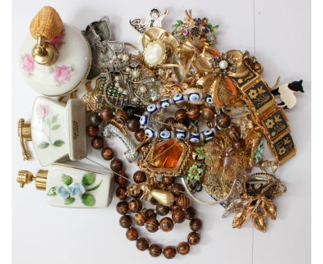 A collection of costume jewellery, including paste, filigree, yellow and white metal brooches along with enamel necklaces, al