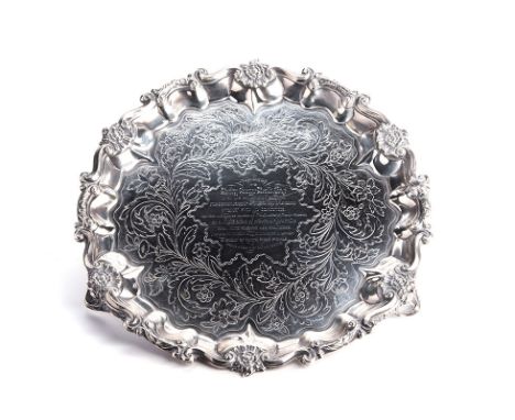 A WILLIAM IV SILVER SALVER, MAKER’S MARK INDISTINCT, PROBABLY JONATHAN HAYNE,  LONDON, 1830 of shaped circular form with flow