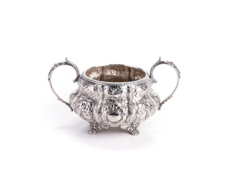 A GEORGE IV IRISH SILVER TWO-HANDLED SUGAR BASIN, EDWARD TWYCROSS, DUBLIN, 1827 of lobed, baluster form with a flowerhead rim