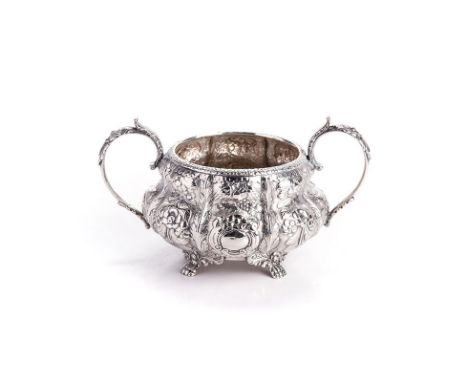 A GEORGE IV IRISH SILVER TWO-HANDLED SUGAR BASIN, EDWARD TWYCROSS, DUBLIN, 1827 of lobed, baluster form with a flowerhead rim