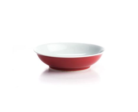 A CHINESE ‘RUBY-BACK’ SAUCER DISH the shallow rounded sides rising from a slightly tapering foot into a flared rim, the exter